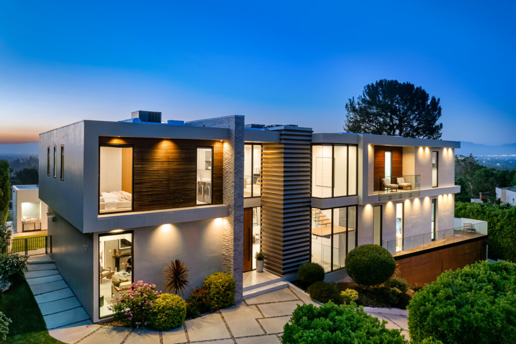 Contemporary house with city lights visible from the balcony
